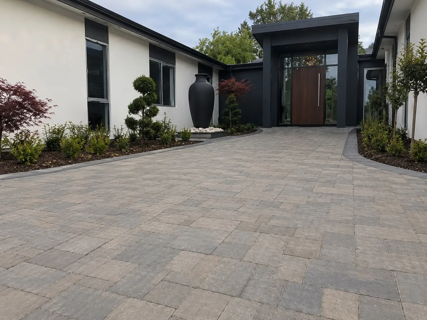 Paved front entry leading to a timber door on a modern Darwin house